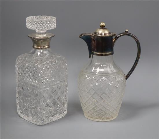 A silver collared glass decanter and stopper and an electroplate mounted claret jug